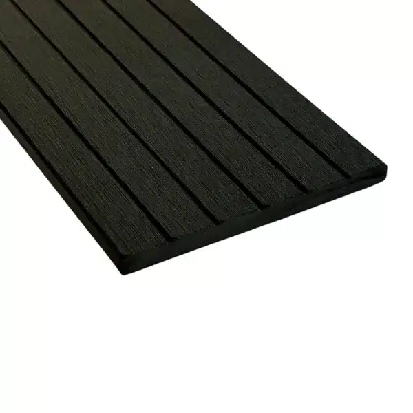 Black composite woodgrain fascia board with a grooved reverse side for flexible installation