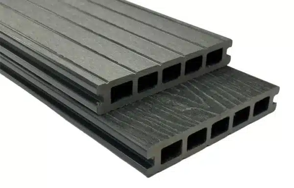 Grey composite woodgrain board with a grooved reverse side for increased functionality