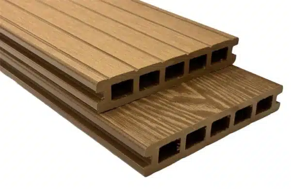 Teak composite woodgrain board with a grooved reverse side for structural applications